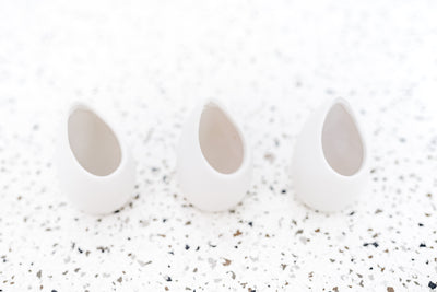 Trio of Small Ivory Ceramic Vases with Flat Bottom and Hole for Hanging